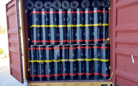 Upright waterproofing membrane rolls loaded for Libreville